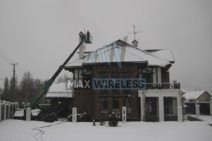 Установка антенного поста на крыше дома в зимний период